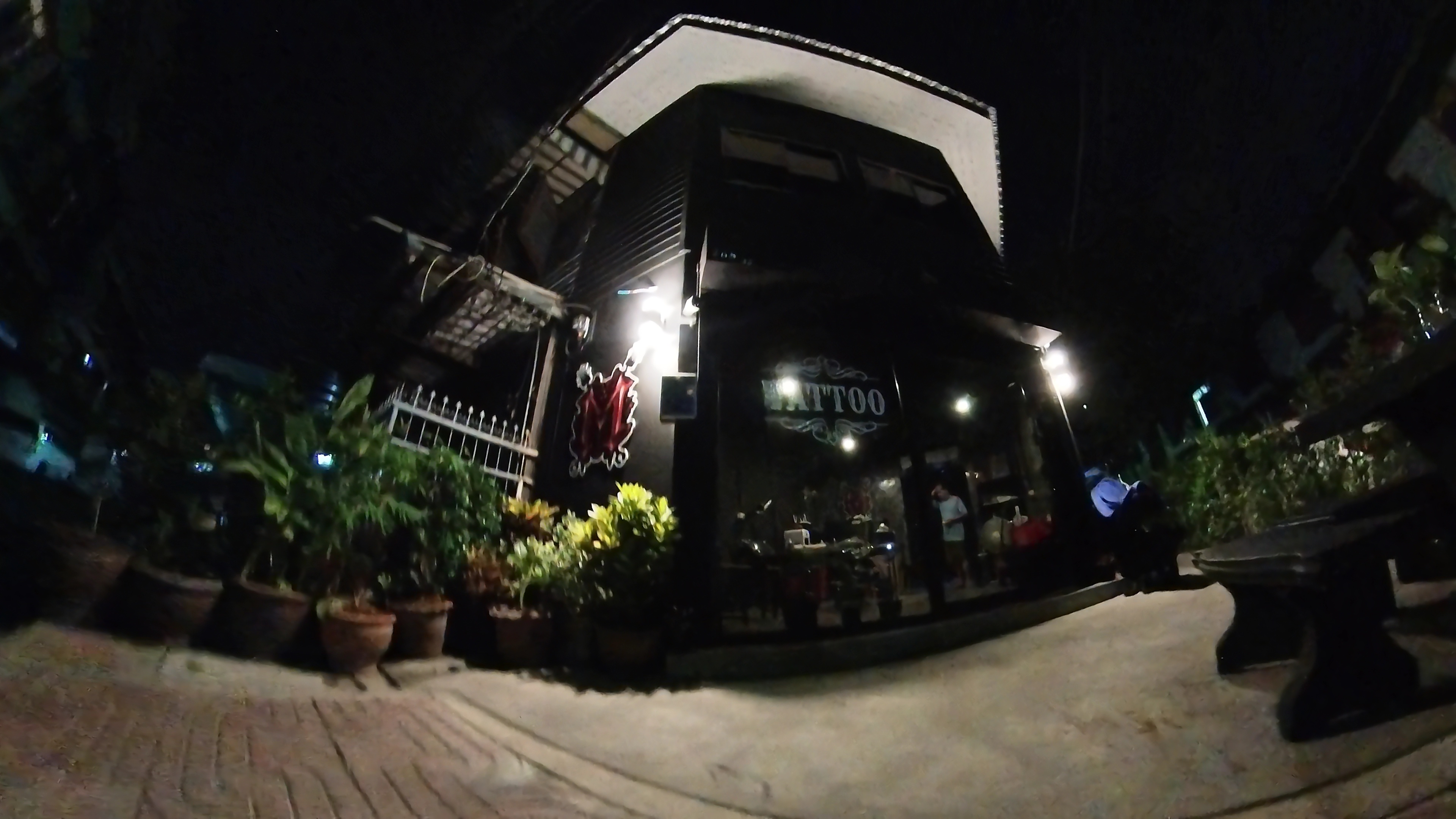 Maso Tattoo Studio building at night.